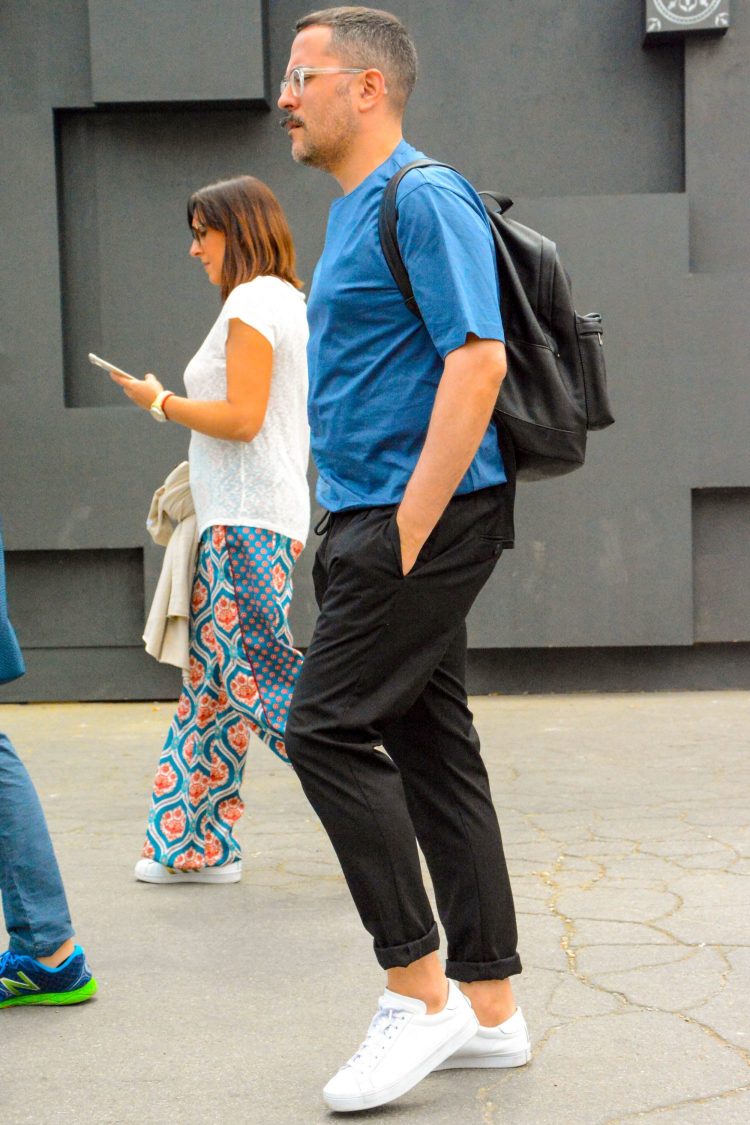 Easy-going black pants create a relaxed atmosphere