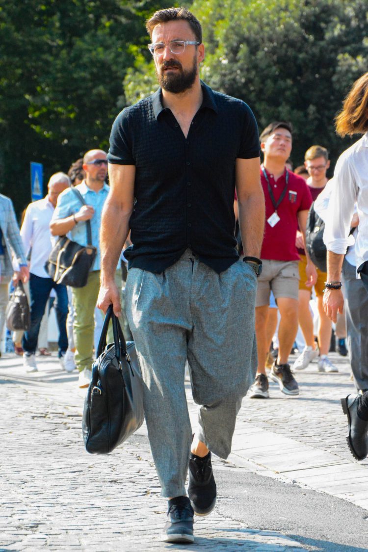 Black shirt with wide gray pants