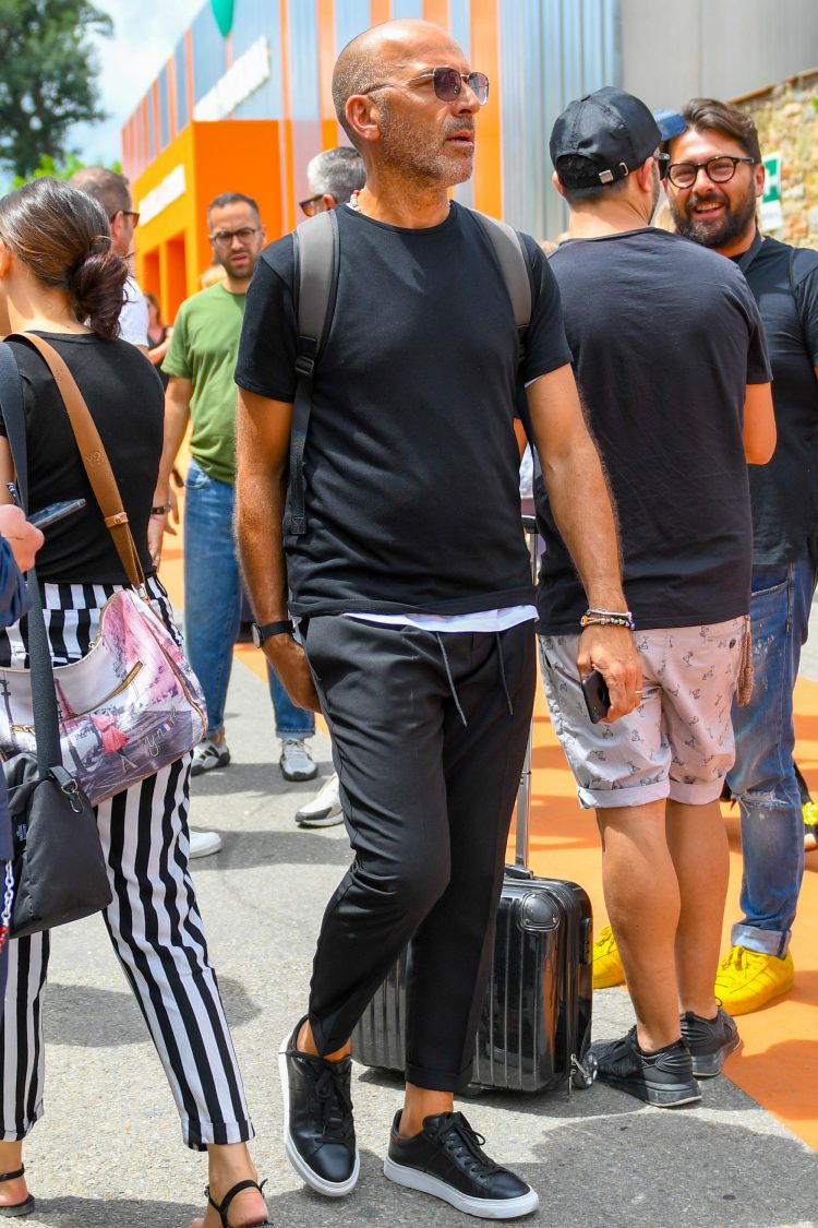Layered T-shirt adds a touch of sophistication to the black coordinate.