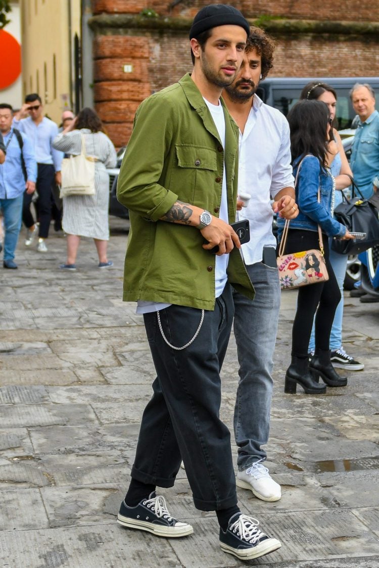 Create a stately look with a khaki shirt and black pants.