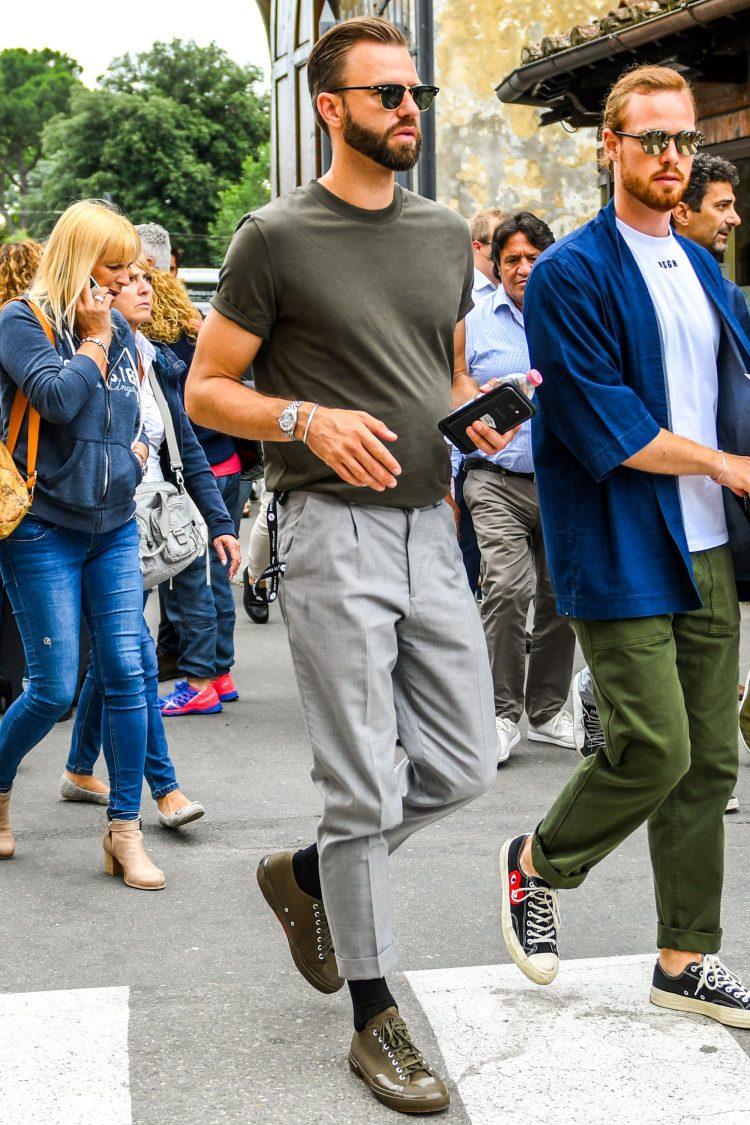 Use gray pants to accentuate a khaki T-shirt and khaki sneakers.
