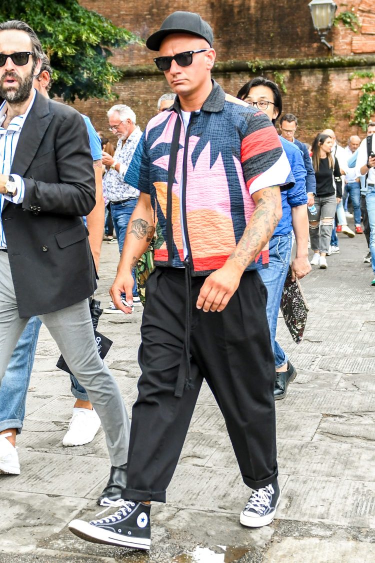 The impact of the craig green patterned shirt is neutralized by the inner white T-shirt.