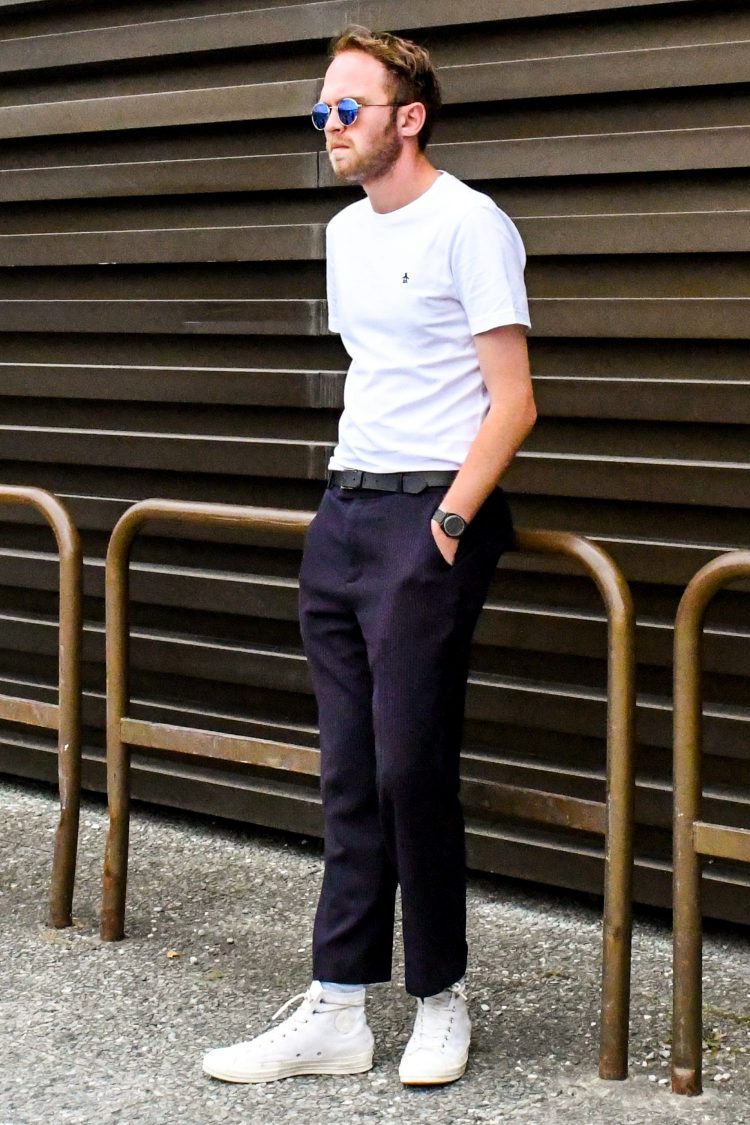 High-cut sneaker length with slacks.