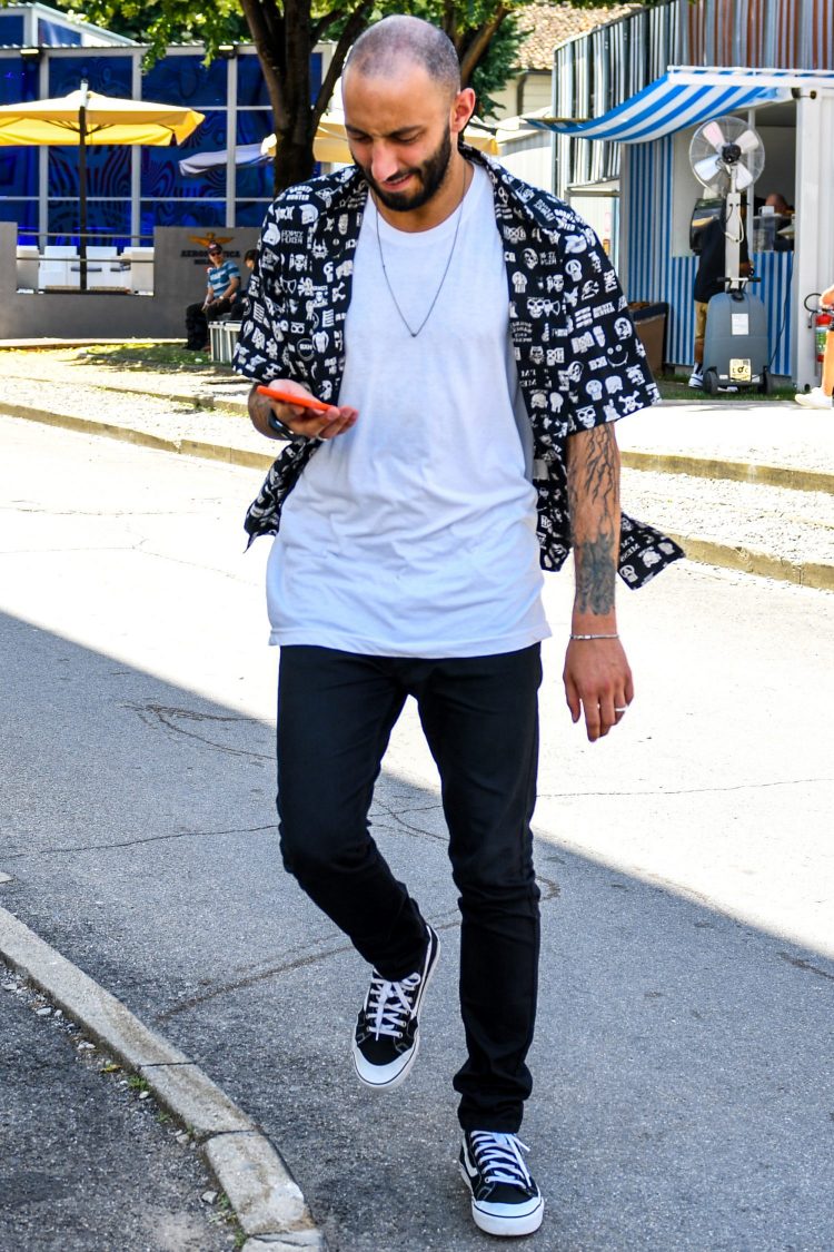 Add a patterned shirt accent over a white T-shirt.