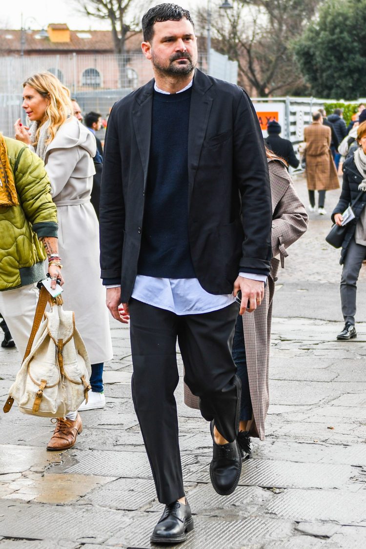 Effortless set-up style with a relaxed black suit and layered innerwear