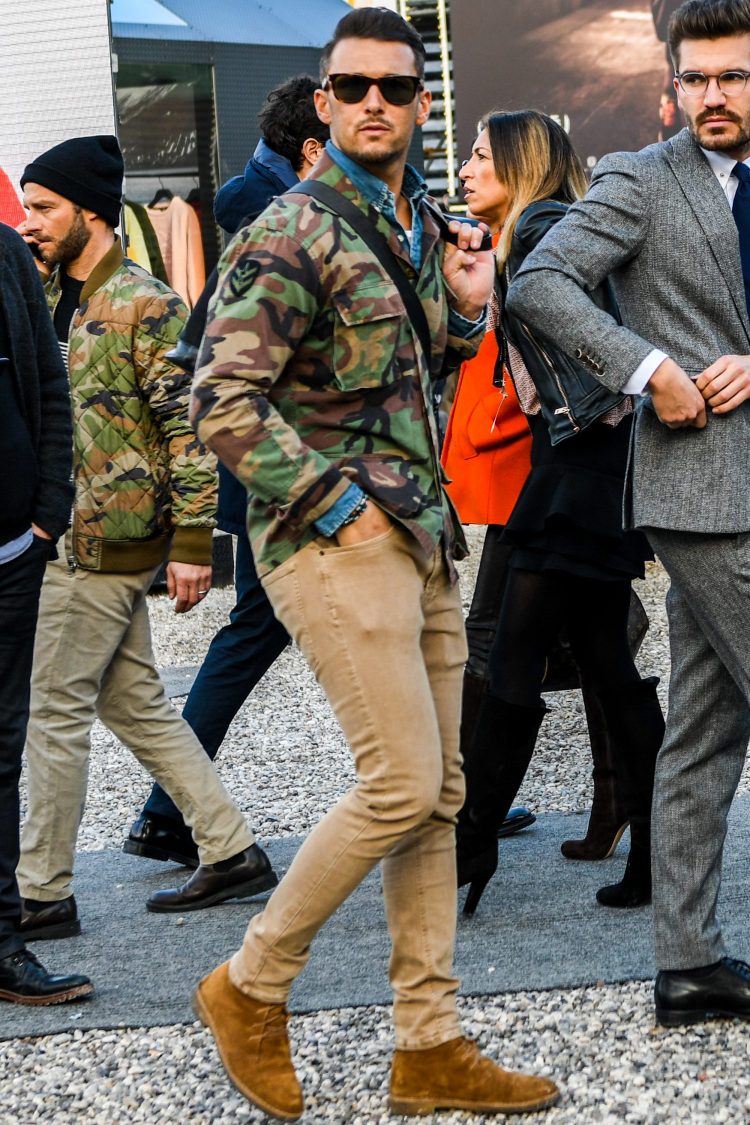Camouflage jacket and matching denim shirt layered together