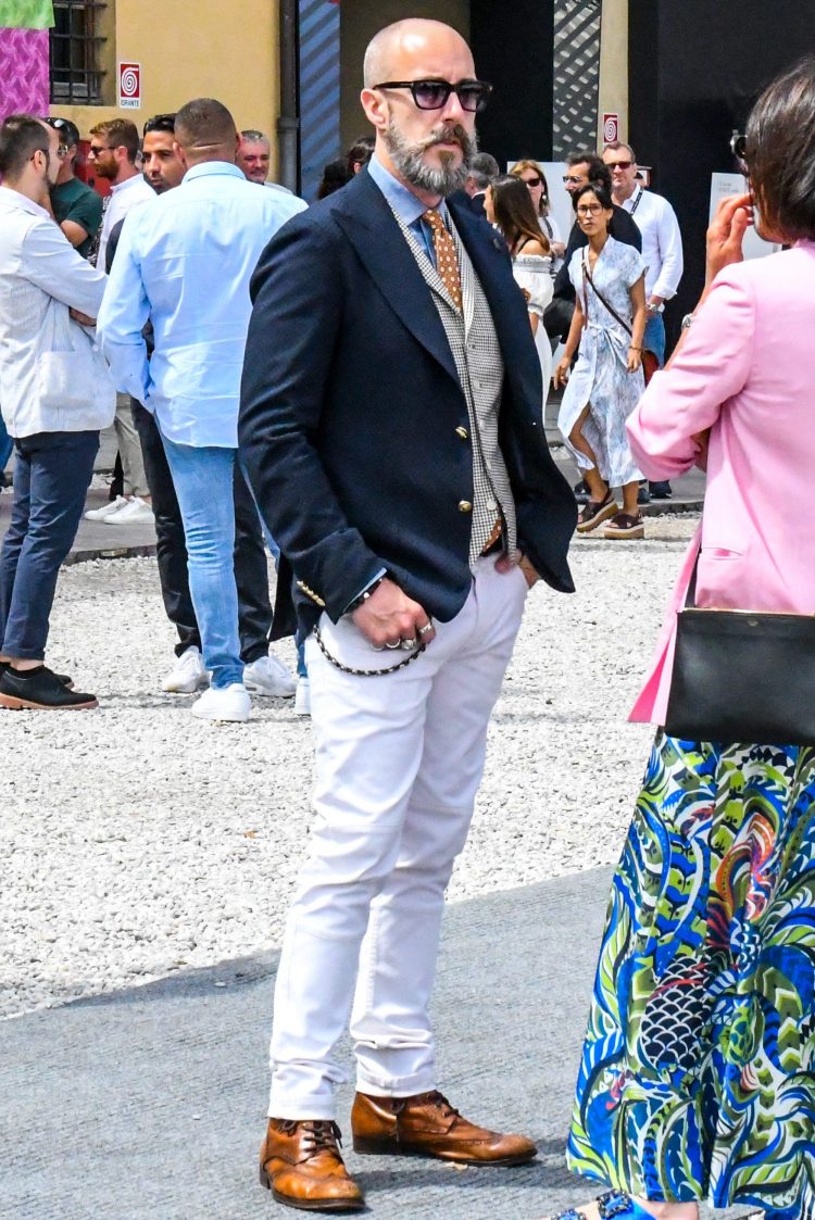 Updated navy blue bracelet style with classic gilet and white pants