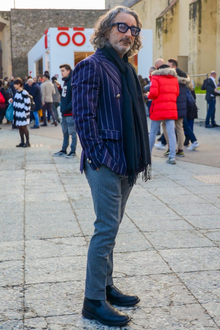 Chic jackets with a glossy striped navy blazer and beautifully silhouetted gray trousers