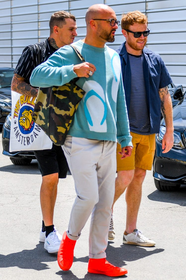 Coordinate your unique style with bright red high-cut sneakers