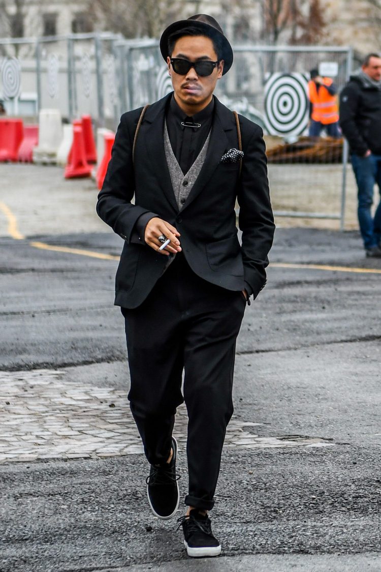 Hazy gilets and sneakers make the all-black suit style fit in with the street.