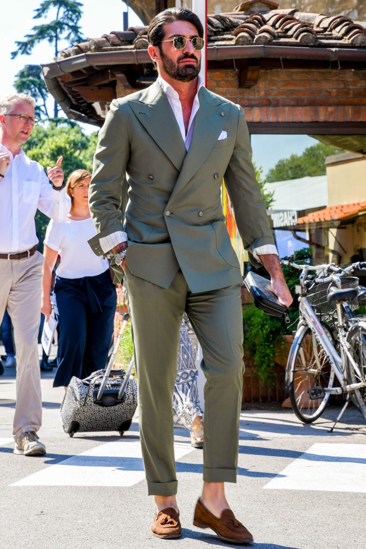 Trend-conscious olive double-breasted suit and brown suede loafers