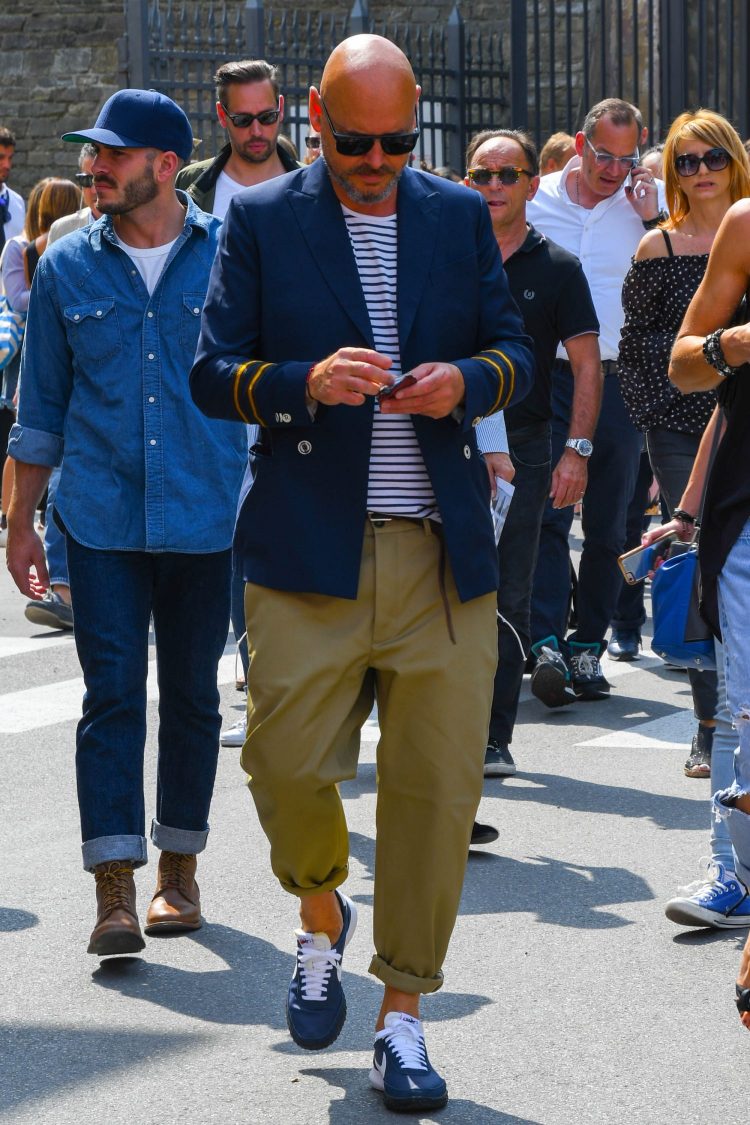 Navy double jacket marine style with khaki pants for a mischievous look.