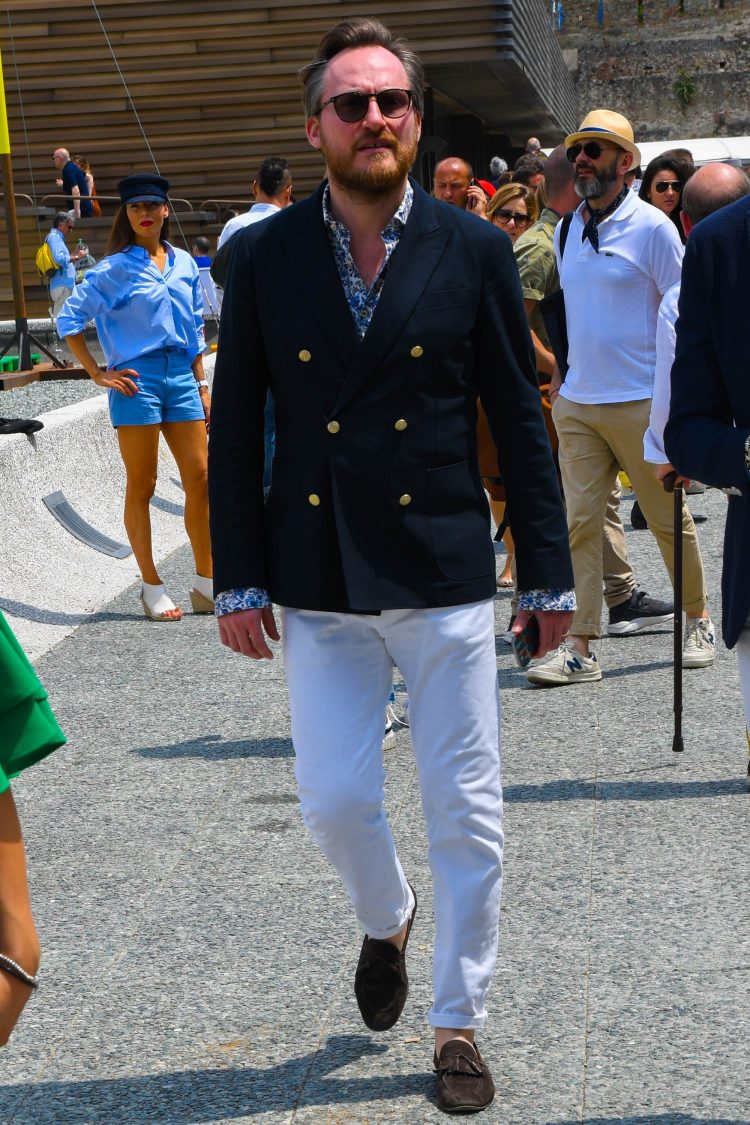 Spice up the navy blazer and white pants style with a patterned shirt to spice up the glossy look