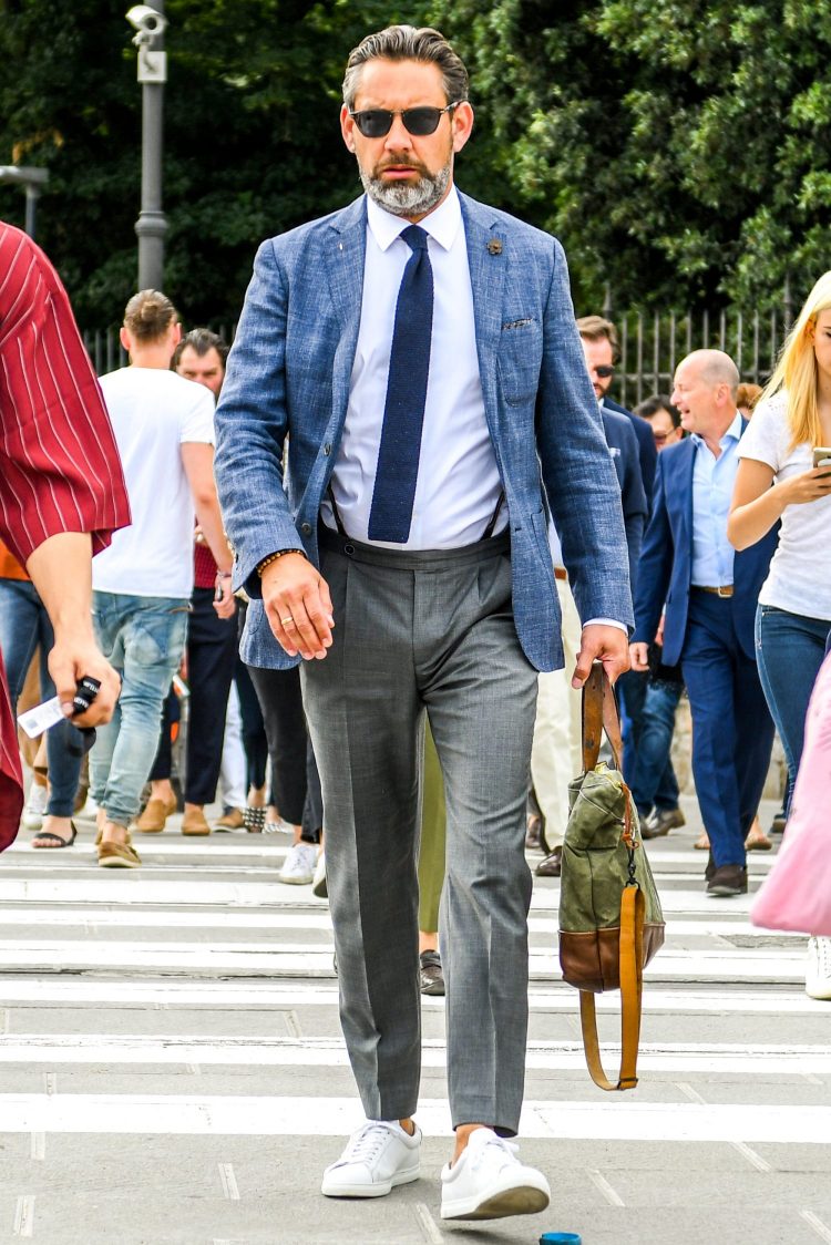 Tied-up jacket and sneaker coordination differs by the material.