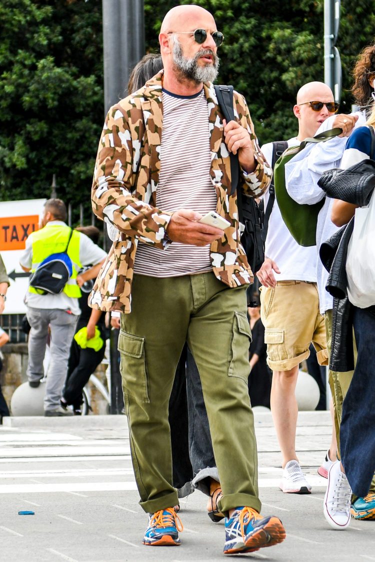 Mix of dress and military with camouflage tailored jacket for added elegance
