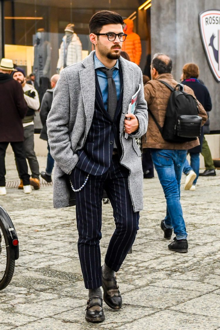 Stylish gray chester coat coordinate with contrasting navy striped suit