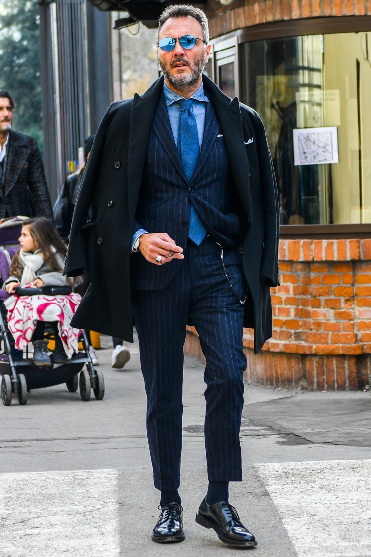 Tone-on-tone style of navy chester coat with a chambray denim shirt for a hazier look