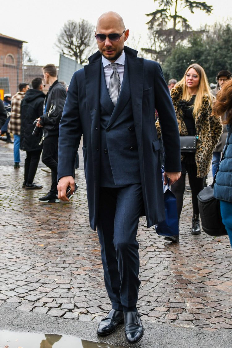 Construct a noble business suit style with a navy chester coat