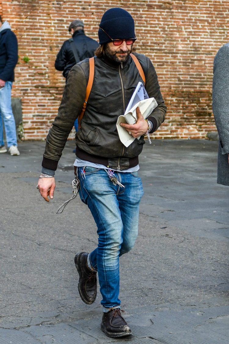 Brown leather jacket adds a touch of austerity to a rugged style