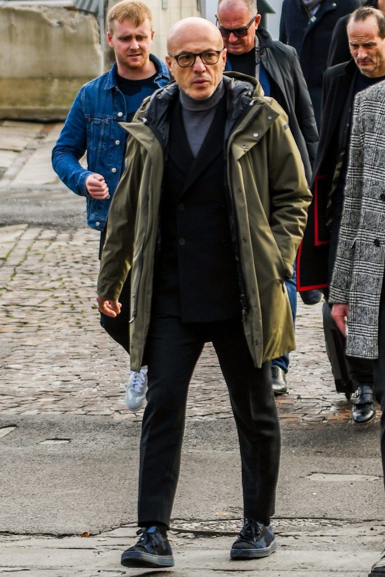 A monotone suit coordinate spiced up with a mod coat
