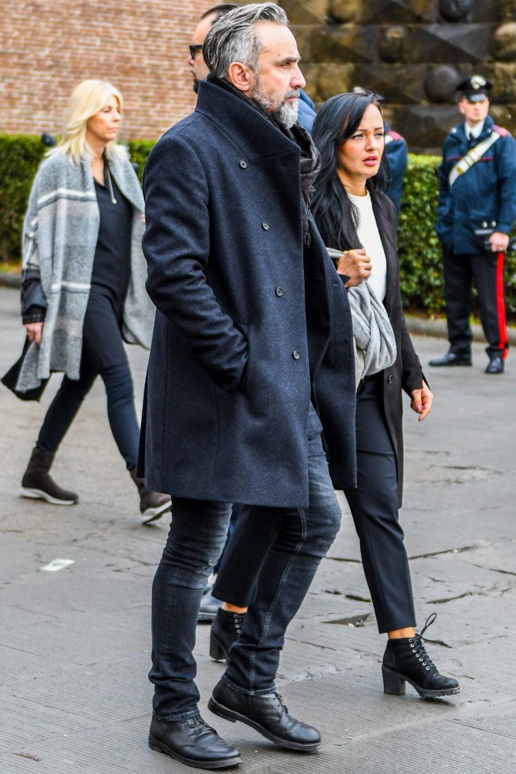 Black denim with a processed finish adds depth to the look.