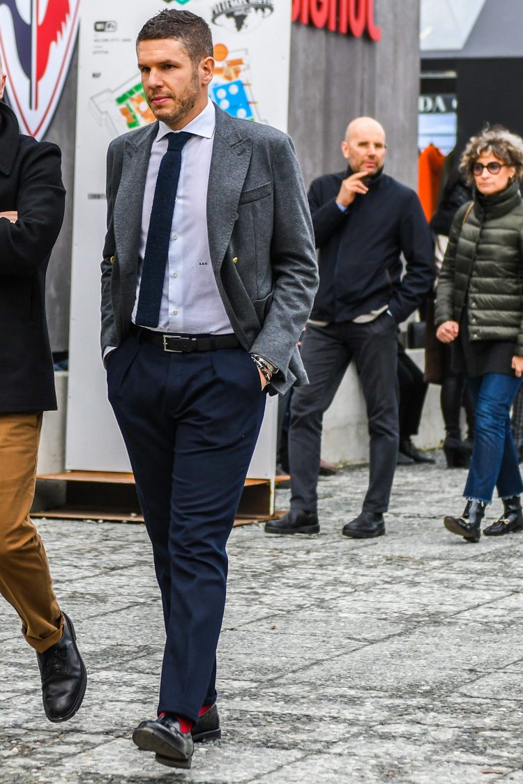 Orthodox jackets style coordinated with navy pleated pants