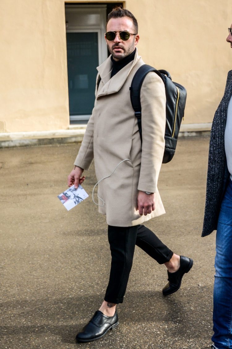 Black pants with a beautiful leg silhouette and black leather shoes worn barefoot for elegant footwear