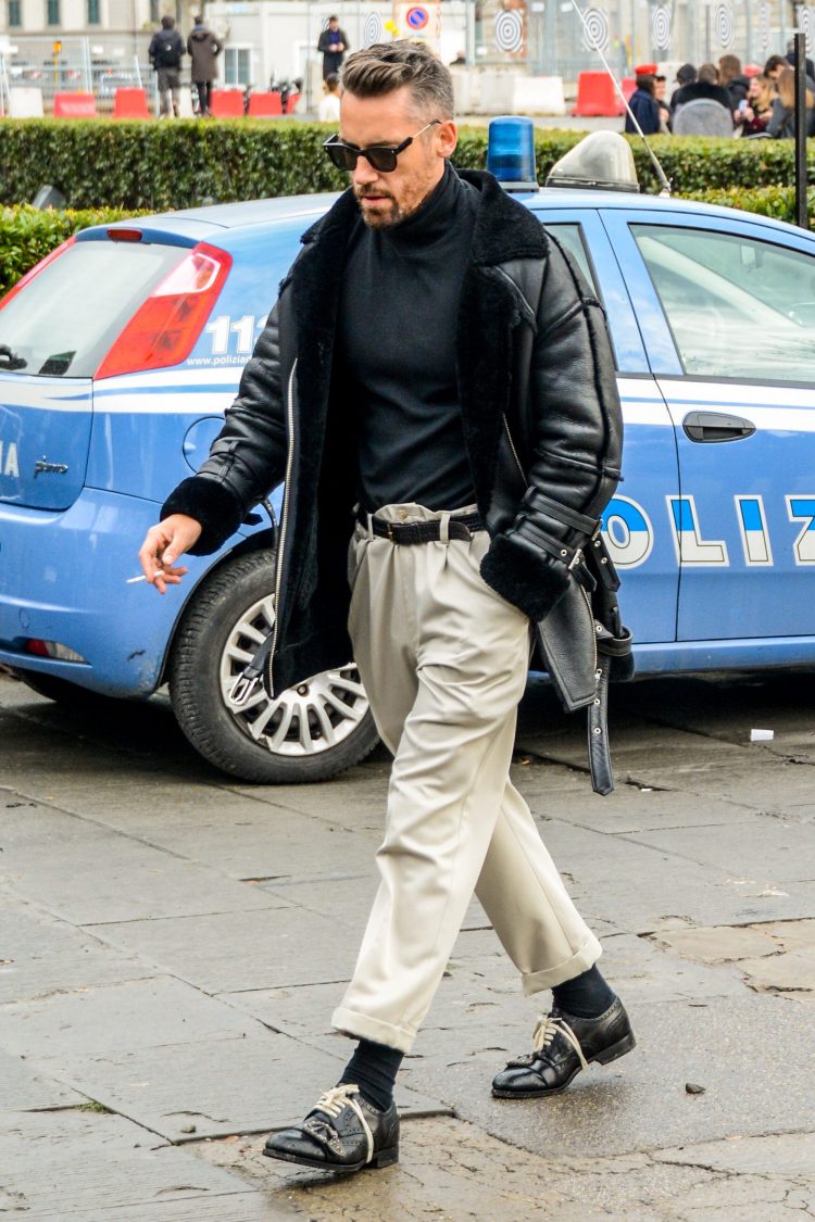 Luxurious monotone style coordinated with an edgy black shearling coat and off-white pleated pants