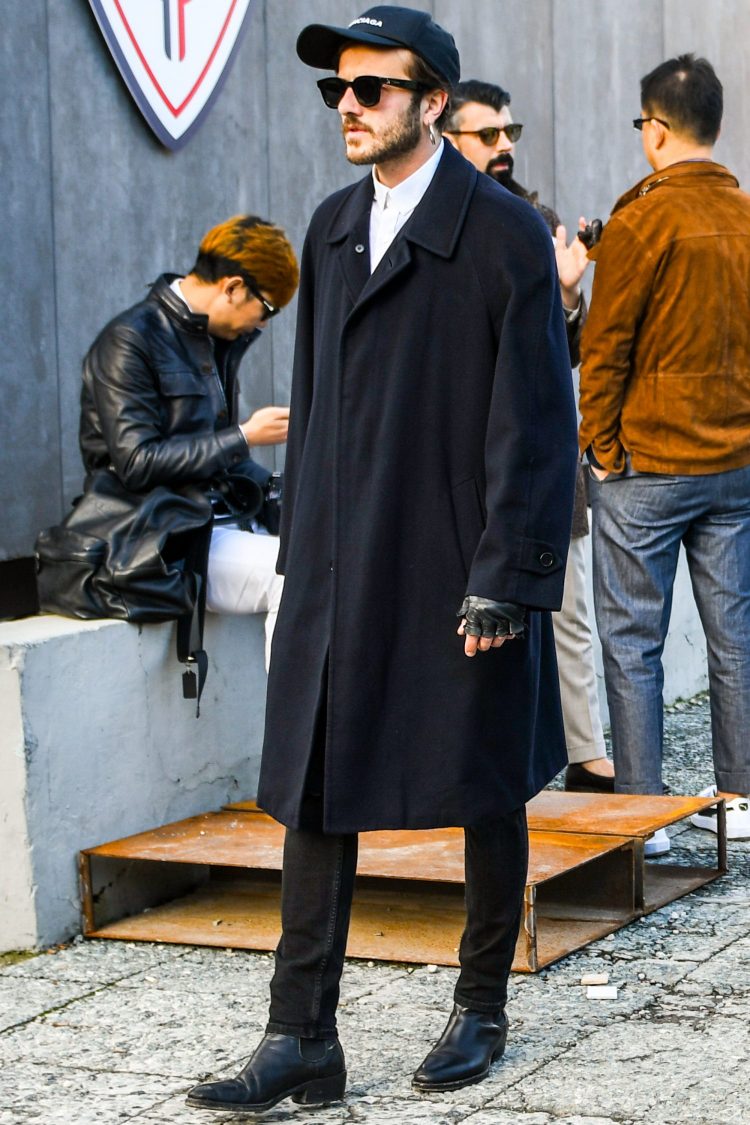 Monotone street style with black pants with an edgy twist on the dress