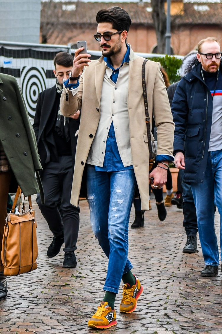 Damaged jeans with a hint of hassle on the legs.