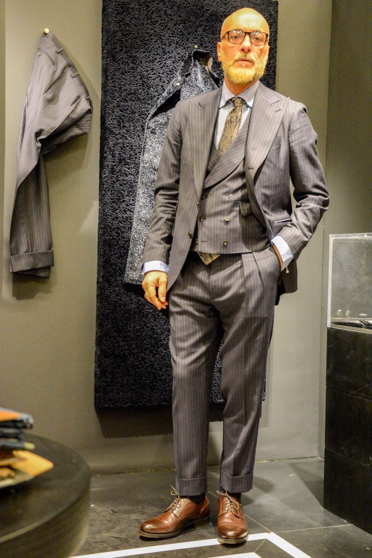 Three-piece masculine gray double stripe suit styling