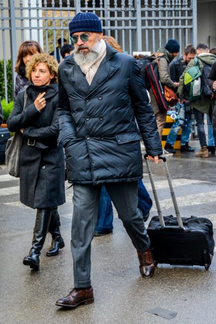 Jacketed down jacket with lapels and gray slacks express a jacket-like coordinate
