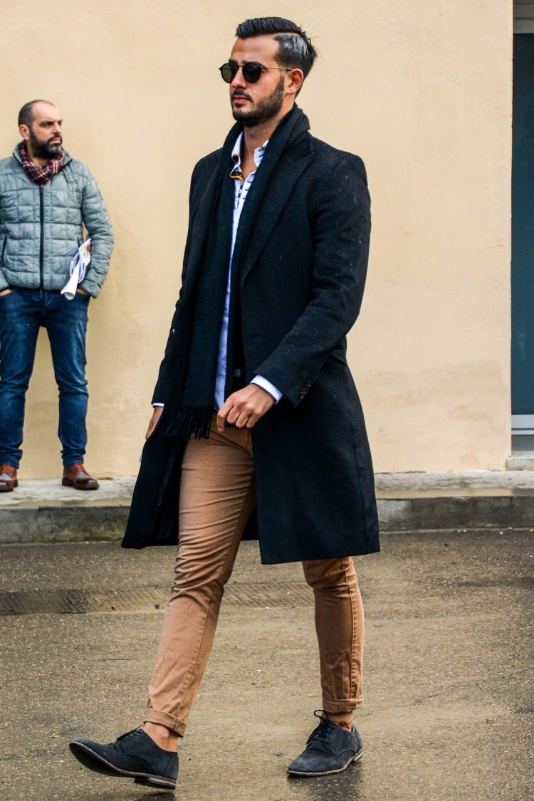 Men's coordination of derby black suede shoes blending into a chic atmosphere.