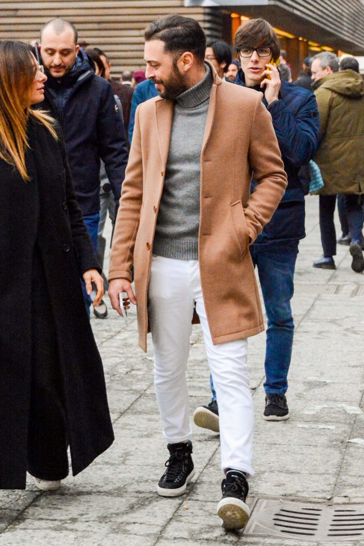Elegant atmosphere of beige coat and gray knit is boosted by the white pants coordinate