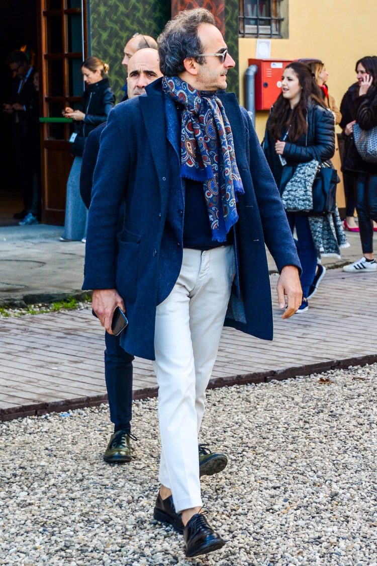 White pants coordinate with contrasting navy tone-on-tone top