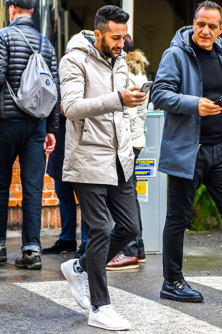 Beautiful men's coordinate of beige hooded coat contrasted with grey trousers