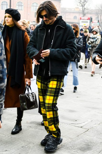 Black track trainers with vivid plaid pants for a playful coordinate