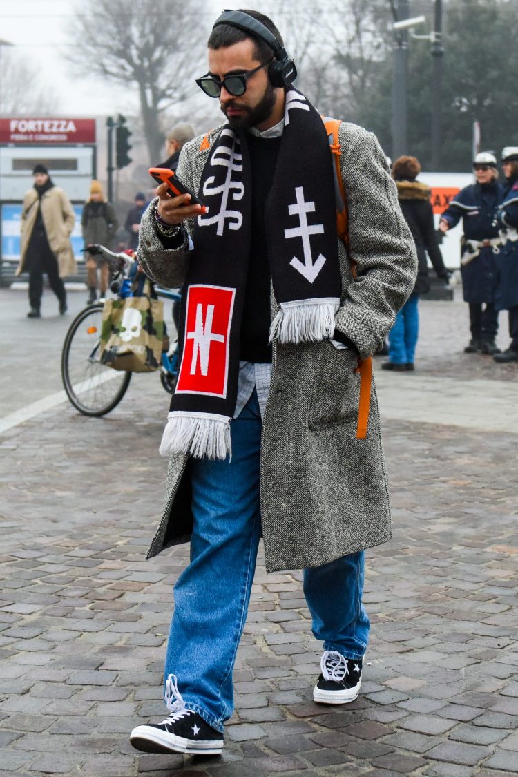 Add a seasonal street style to a casual gray coat with a flashy patterned scarf.