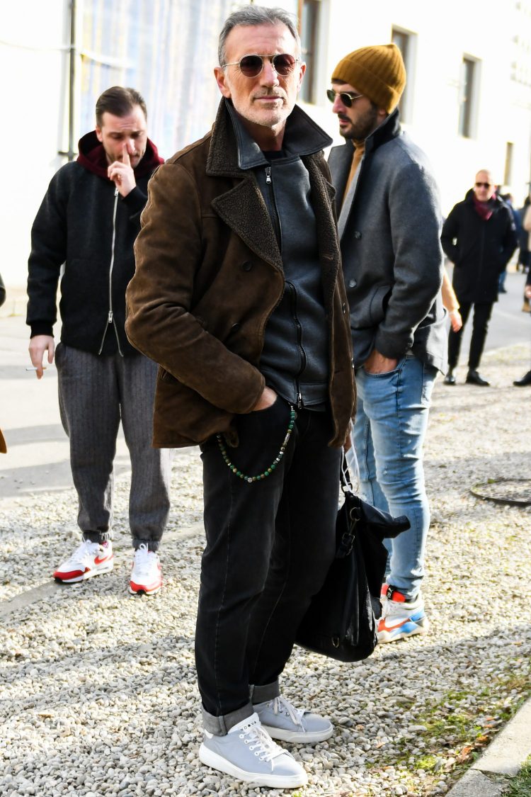 Armed layering coordinate with a leather P-coat and a rider's jacket
