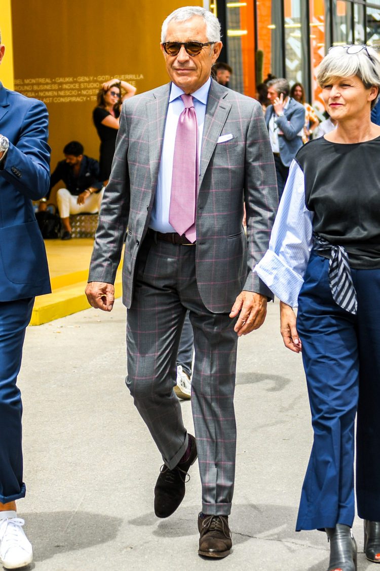 The stylish use of pink in a checkered gray suit for a glamorous look