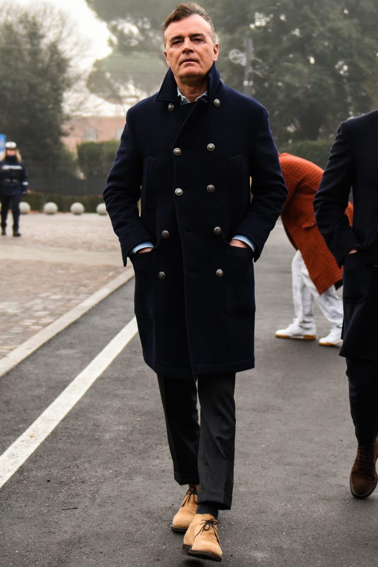 Navy coat with metal buttons gives the cord a military look.
