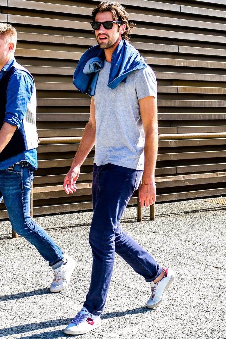 Spice up your look with leather sneakers in a subtle contrast of navy and gray