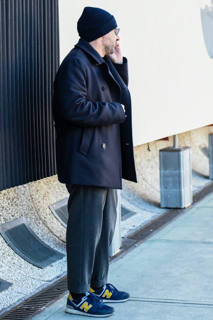 Conservative style using a navy coat with a touch of yellow for a more coordinated look