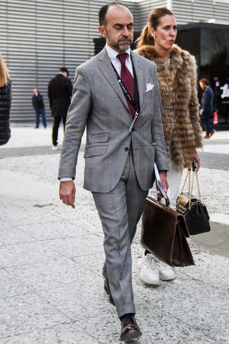 Checked gray suit with glossy accessories as accents