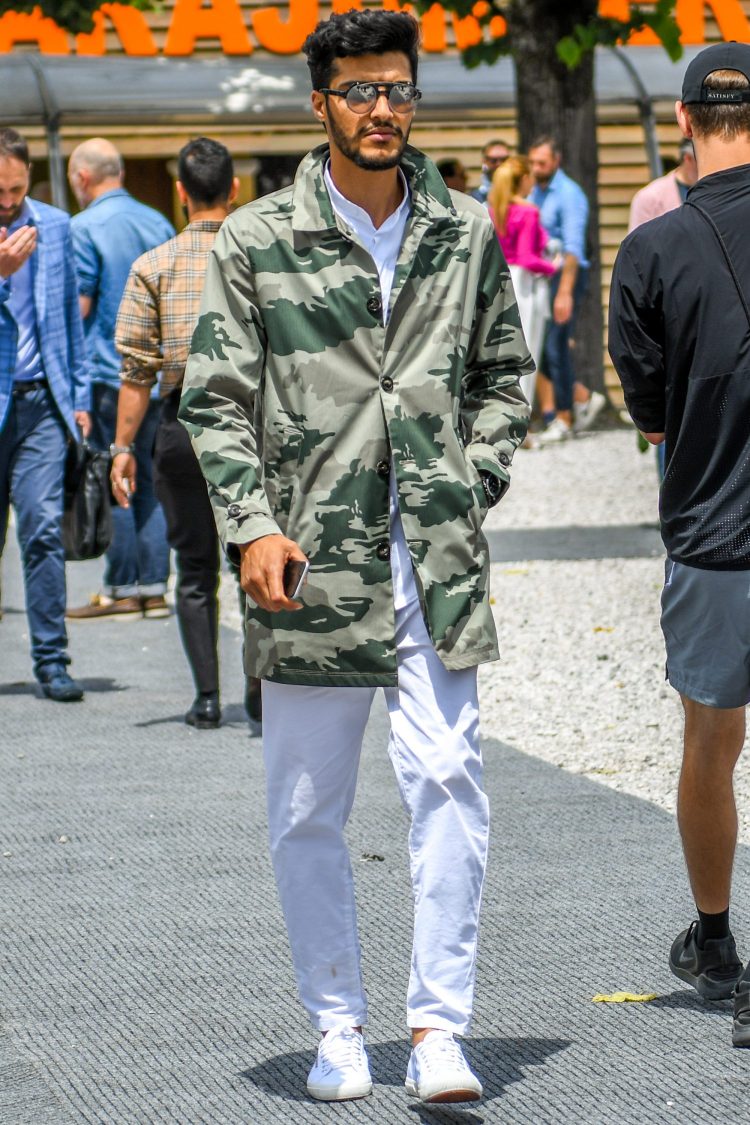 The presence of the camouflage-patterned nylon outerwear is enhanced to the utmost limit by coordinating white items.