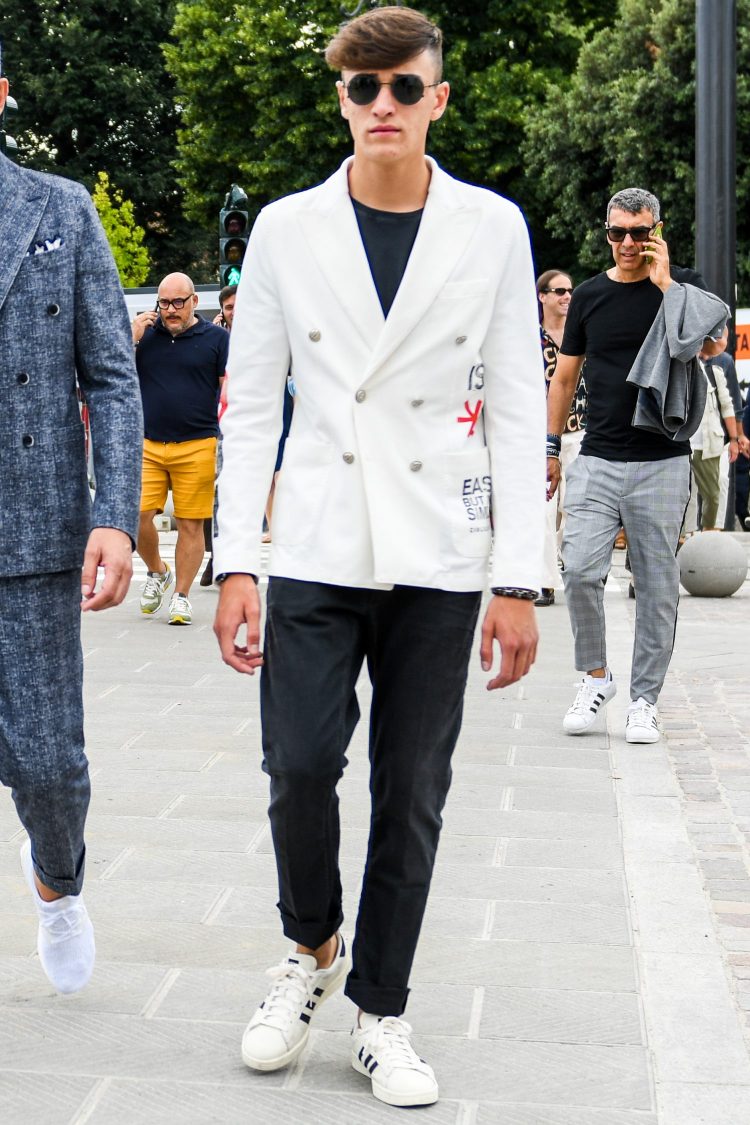 Monotone white blazer coordinated with graphic prints tuned to an immaculate look