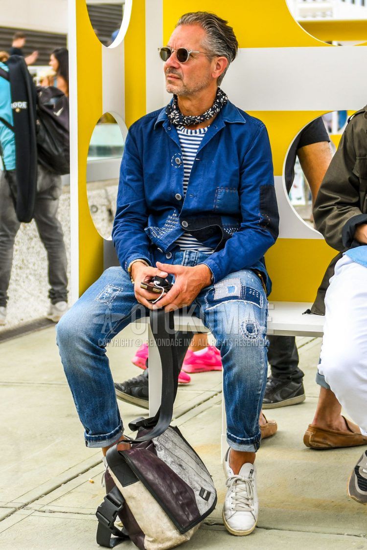 Plain white/black sunglasses, navy or other bandana/neckerchief, navy/blue or other shirt jacket, white/blue striped t-shirt, blue/light blue or other denim/jeans, white low-cut Adidas Stan Smith sneakers, white/brown one-pointed shoulder bag, summer/spring/fall men's coordinate outfit.