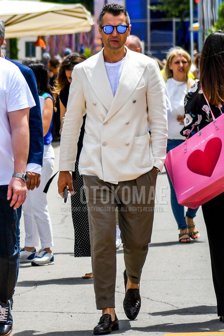 A summer/fall/spring men's coordinate outfit with plain sunglasses, plain white tailored jacket, plain white t-shirt, plain brown ankle pants, and brown tassel loafer leather shoes.
