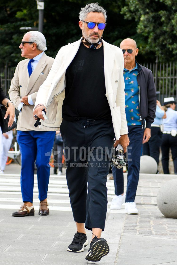 A spring/fall/summer men's coordinate outfit with plain sunglasses, navy other bandana/neckerchief, plain white tailored jacket, plain black t-shirt, plain navy easy pants, plain cargo pants, and black low-cut sneakers.