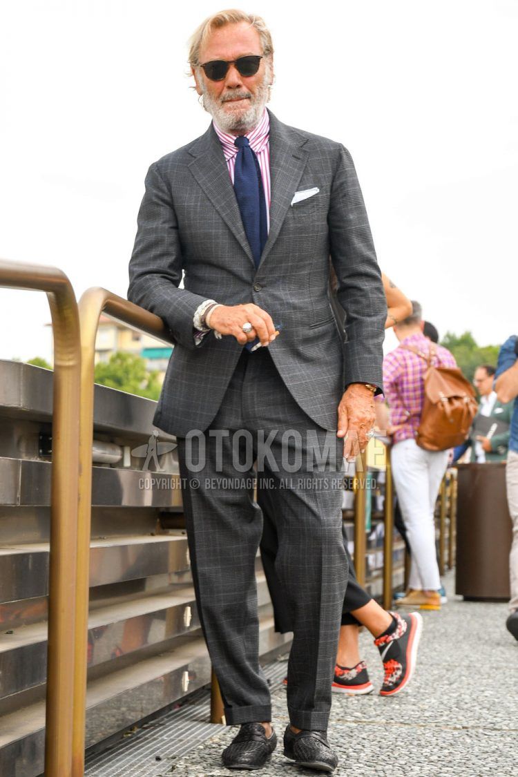 Men's spring, summer, and fall outfits with plain sunglasses, pink striped shirt, gray checked suit, and plain navy tie.